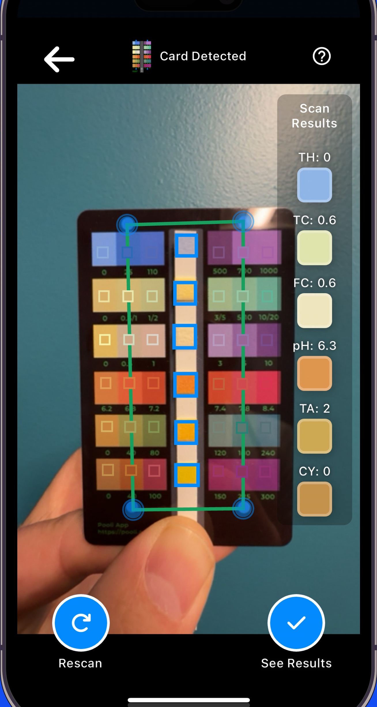 Pooli SCAN with a test strip detected and live results for hardness, chlorine, pH, alkalinity, and cyanuric acid